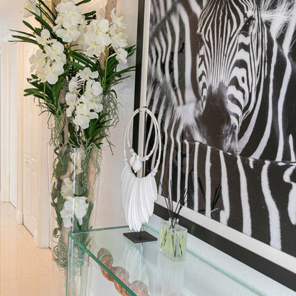 White Vanda Orchids with Driftwood in a Large Conical Glass Cylinder