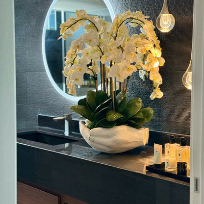 White Phalaenopsis Orchids in Vase with Sculpture "Open Hands"